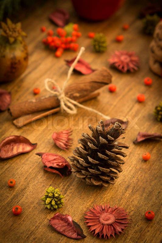 Natural ornaments for Christmas: red fruits, pomegranates, cinnamon sticks .., stock photo