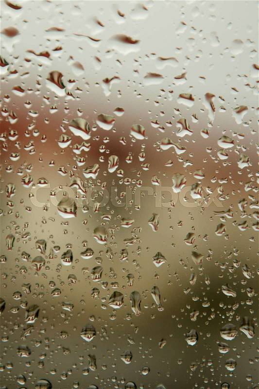 Glass with drops of rain water close up, stock photo