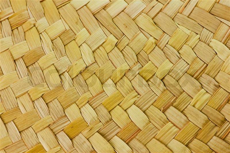 Woven tan straw hat detail for background texture, stock photo