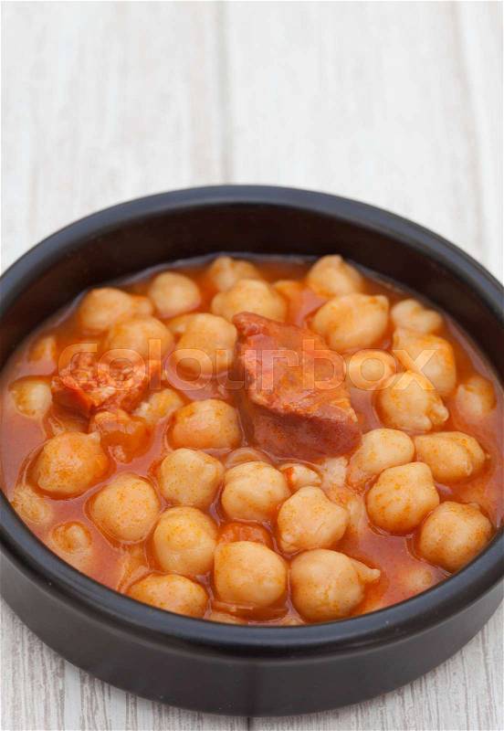 Dish of Spanish-style cooked chickpea. Delicious homemade food, stock photo