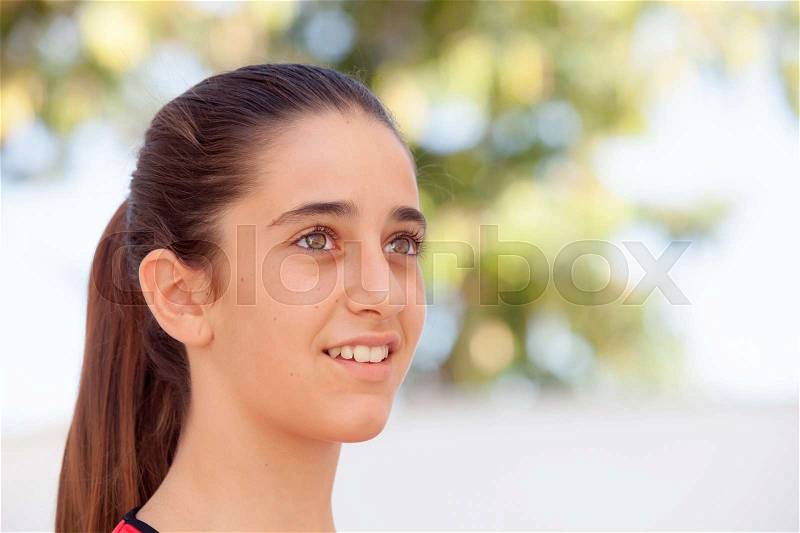 Nice girl twelve year old smiling on the street, stock photo