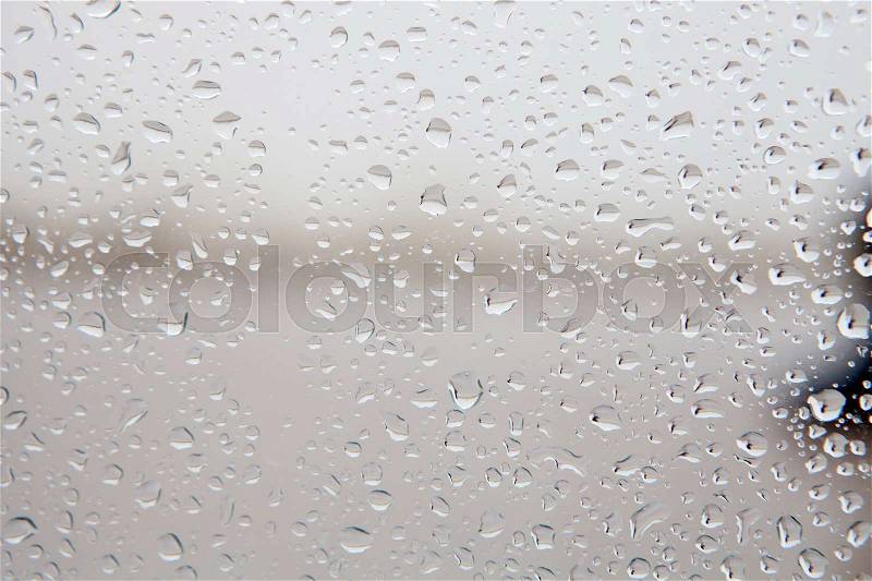 Wet glass with drops of rain fall on the street, \, stock photo
