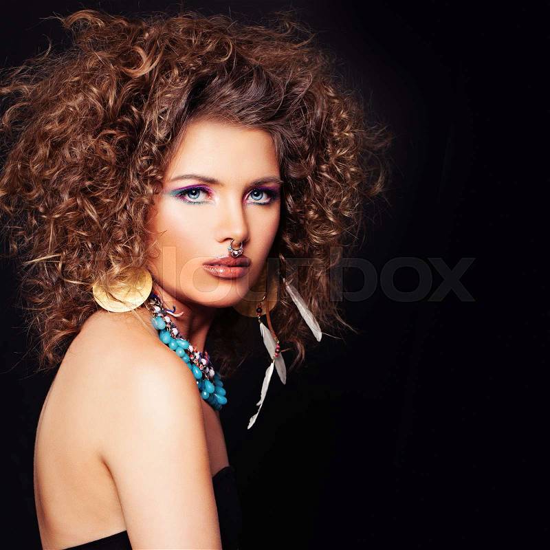 Glamorous Woman on Dark Background. Permed Hair style, Makeup, Accessories, stock photo
