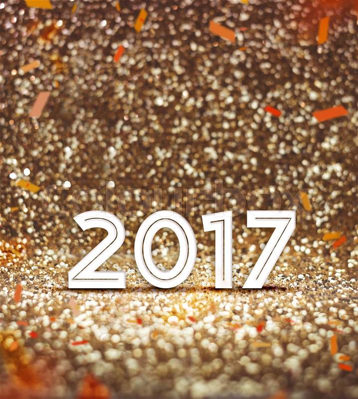 Vintage filter : happy new year 2017 year number with confetti at sparkling golden glitter background ,Holiday Greeting card,leave space for adding your content, stock photo