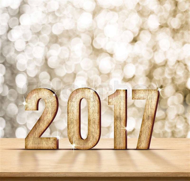 2017 year wood texture on plain wood table top with gold sparkling bokeh wall,Holiday concept,leave space for adding your content, stock photo