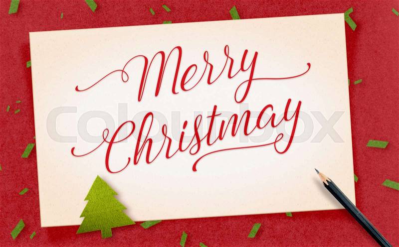 Merry Christmas word on old vintage paper craft with present and pencil with green confetti on red craft paper,Holiday Greeting card, stock photo