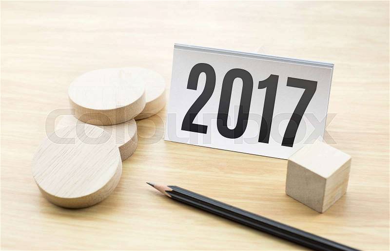 2017 new year on Business card with blank wooden round piece and pencil,Holiday concept, stock photo