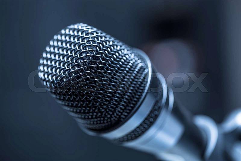 Close-up of microphone in conference room or concert hall, stock photo