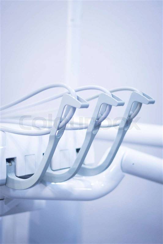 Dentists chair and drills in dental clinic office to treat patients with orthodontics, stock photo