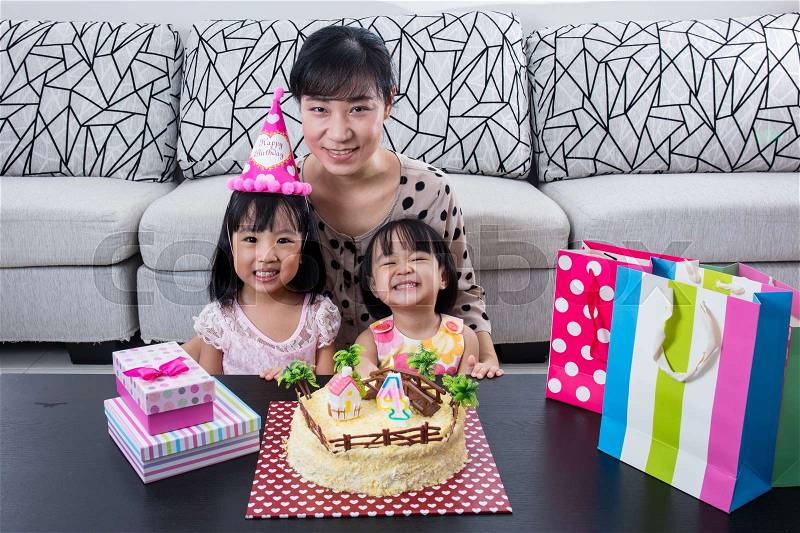 Asian Chinese mom and daughter with celebrating birthday at home indoor, stock photo