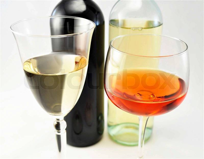 Red and white wine glasses and bottles, stock photo