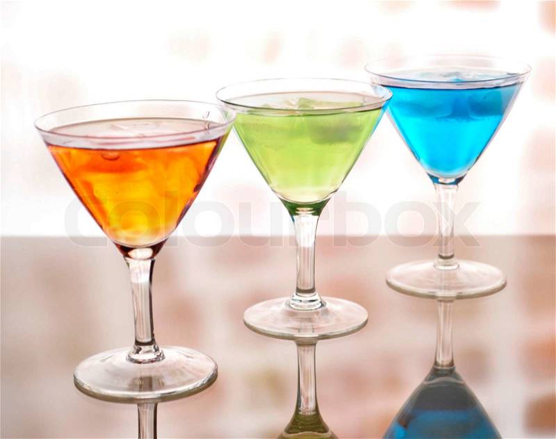 Fruit cold drinks assortment with reflection, stock photo