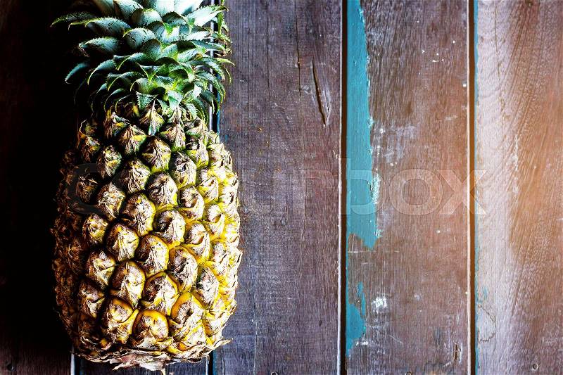 Pineapple on the wood lath old, stock photo