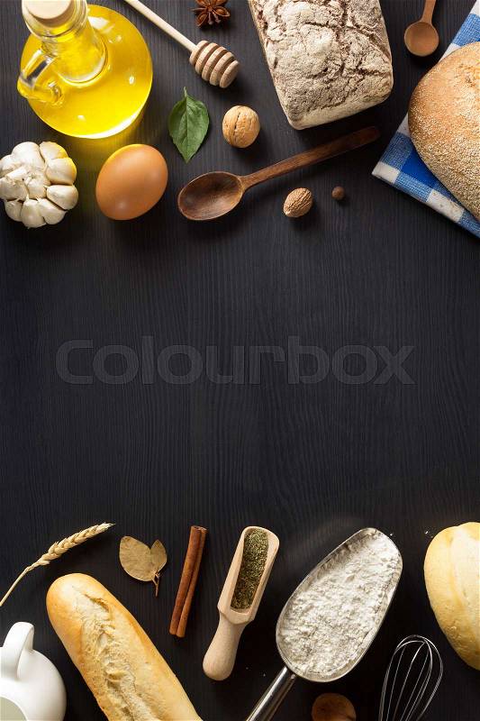 Bread and bakery products on wooden background, stock photo