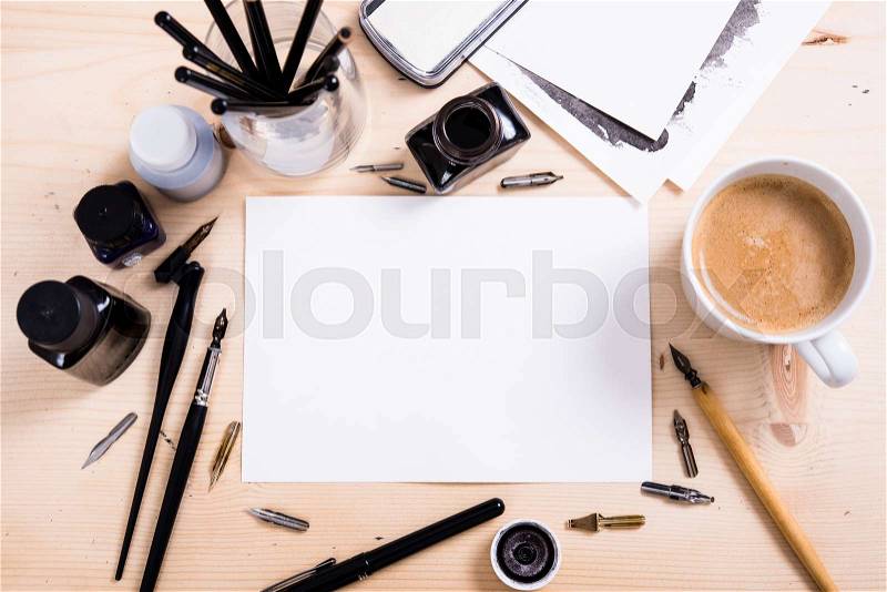 Artist\'s desk and workspace. Paper, ink and calligraphy pens. Creative process, lettering art workshop details with copyspace, stock photo