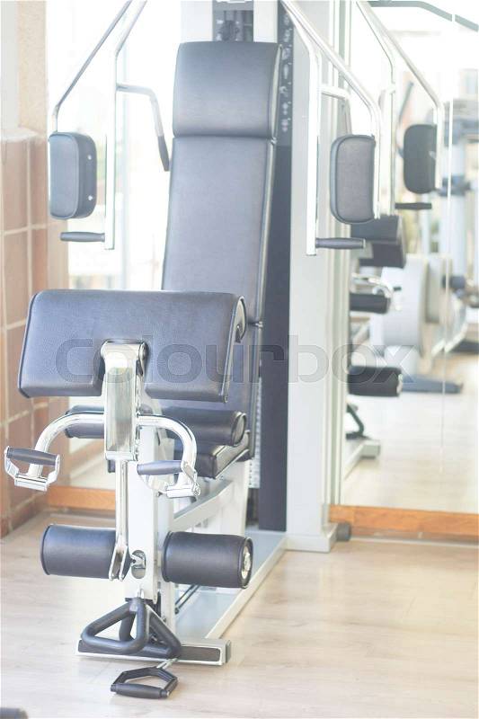 Gym exercise weight training resistance machine in fitness studio used to increase strength and build muscle mass, stock photo