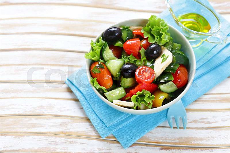 Mediterranean salad with olives, cheese and vegetables. Healthy food, stock photo
