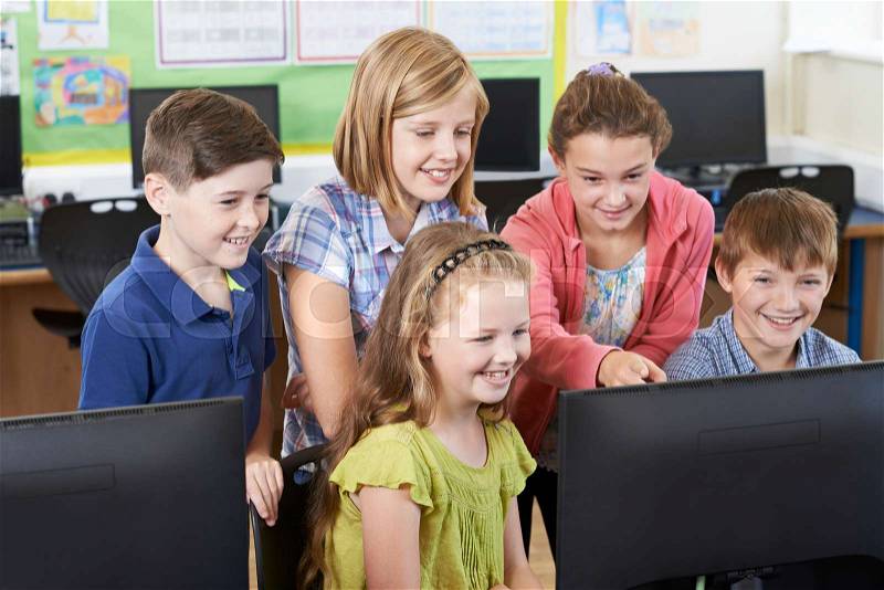 Group Of Elementary School Pupils In Computer Class, stock photo