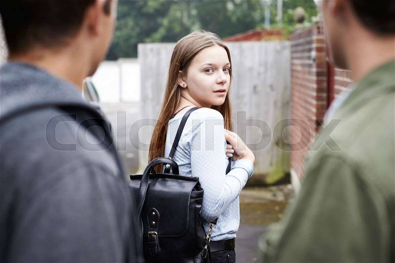 Teenage Girl Feeling Intimidated As She Walks Home, stock photo