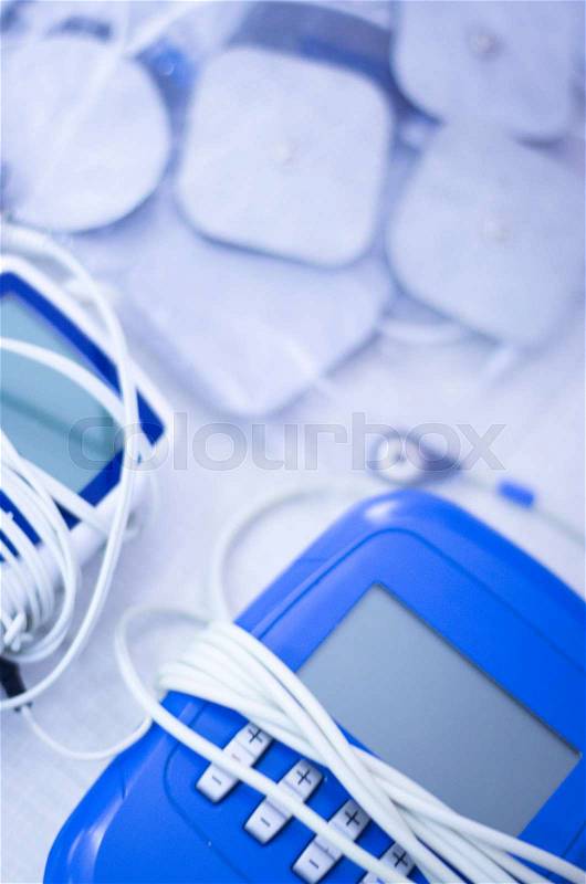 Physical therapy equipment in physiotherapy center for electro impulse treatment sports injury rehabilitation and orthopedics, stock photo