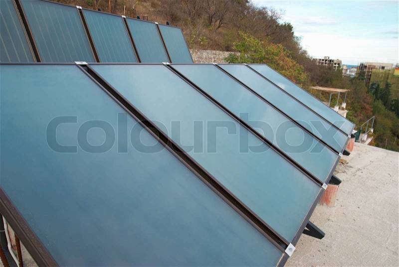 Solar water heating system on the house roof, stock photo