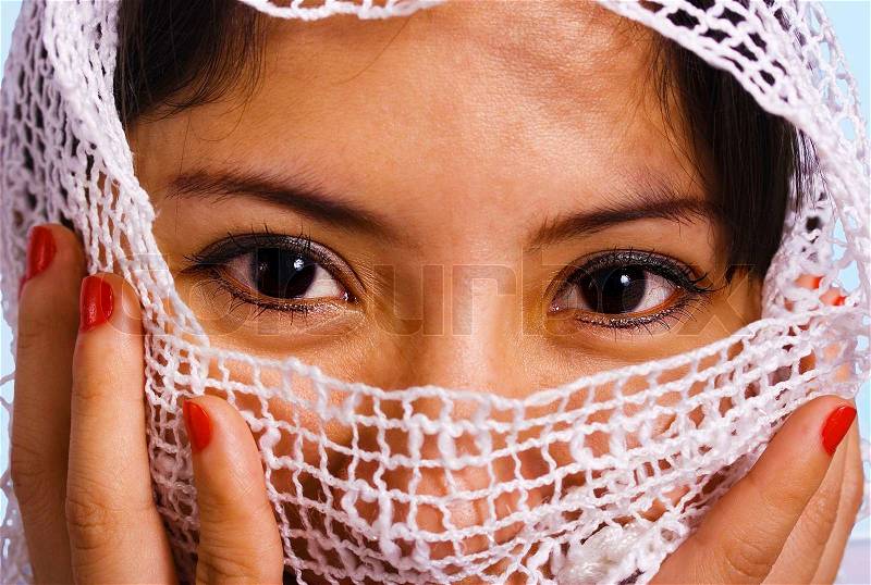 Muslim Woman With A White Cloth Veil Over Her Face, stock photo
