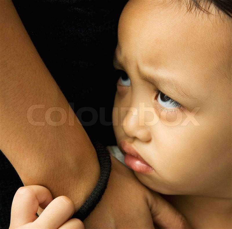 A little girl with a sad face and looking a bit angry, stock photo