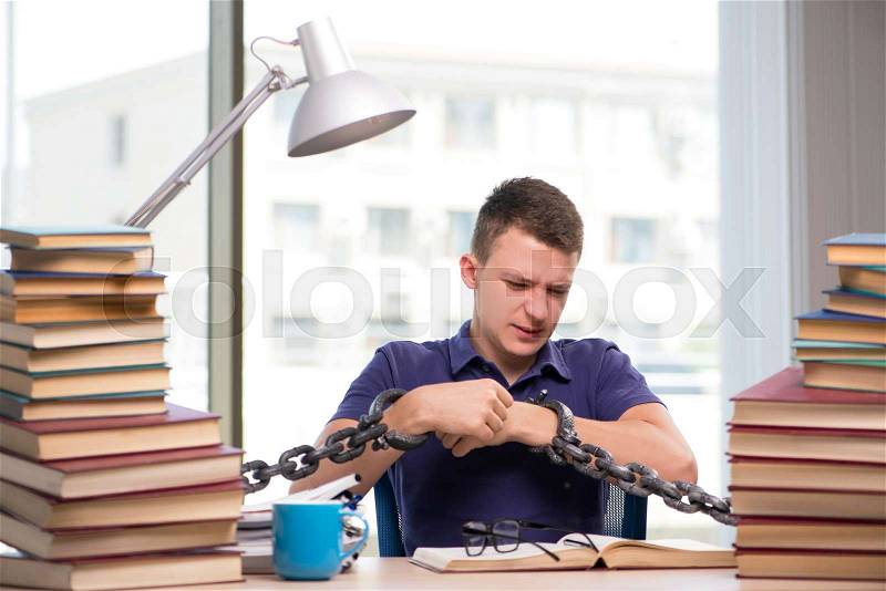 Young student forced to study tied, stock photo