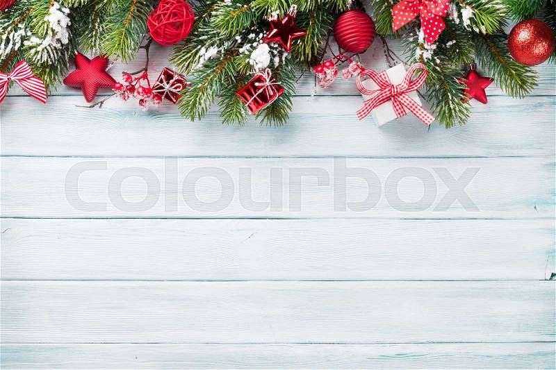 Christmas wooden background with snow fir tree and decoration. Top view with copy space for your text, stock photo