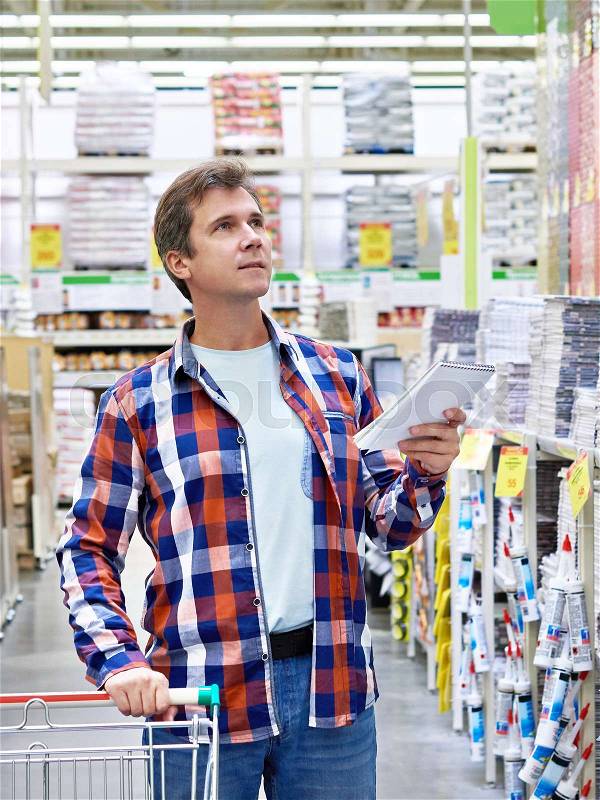 Man in a store building materials, stock photo