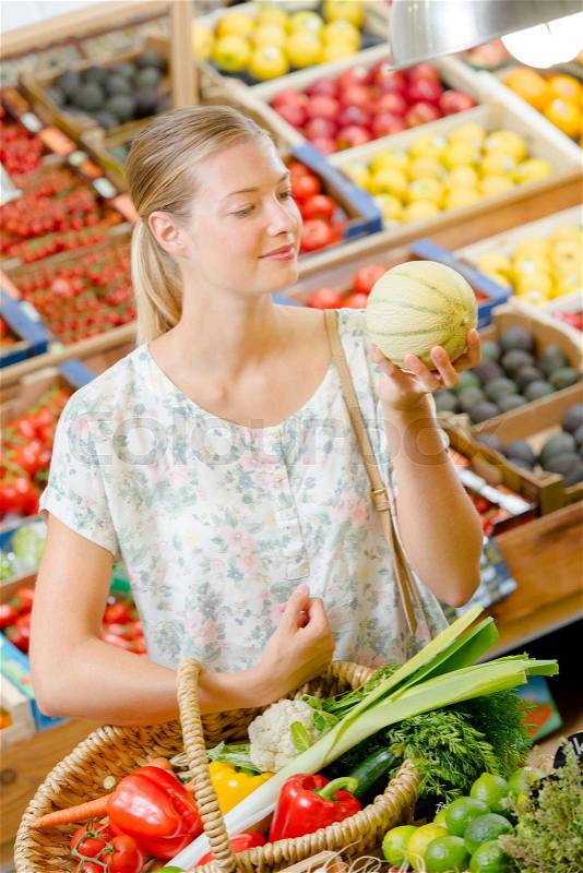 Woman buying fruit, stock photo