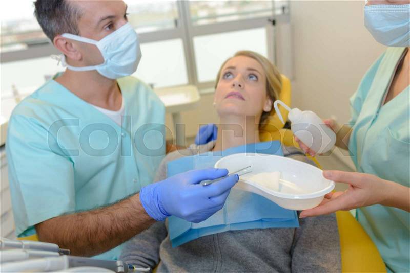 Nervous lady in dentist\'s chair, stock photo