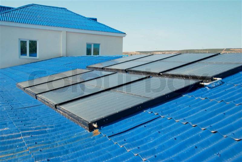 Solar water heating system on the house roof, stock photo