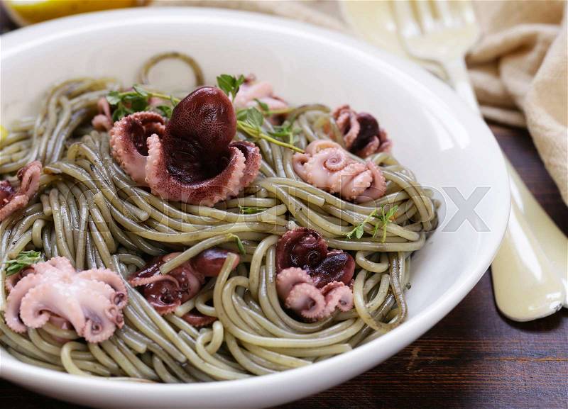 Black pasta with black cuttlefish sauce, stock photo