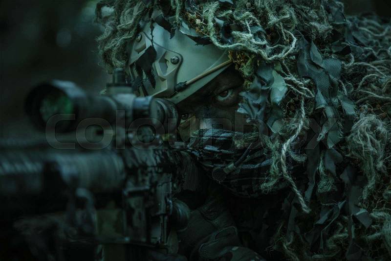 United states army ranger sniper wearing ghillie suit, stock photo