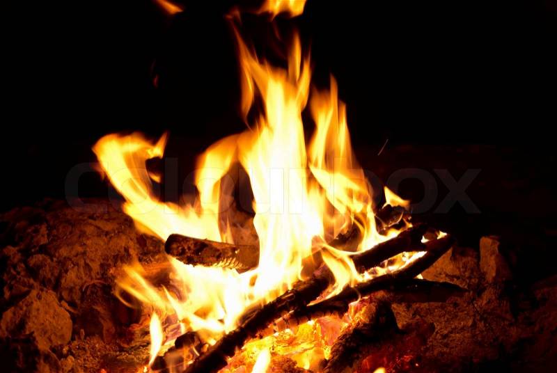Red bright campfire with the black background, stock photo