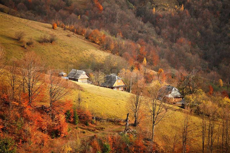 Fall in mountain village. Alpine October scene, stock photo