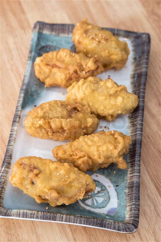 Korean fried chicken with sesame on a plate, stock photo
