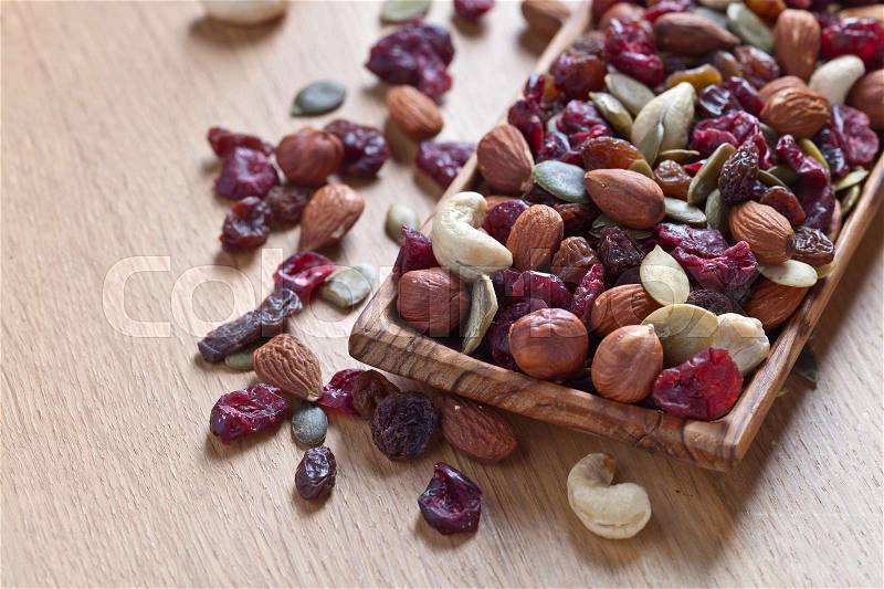 Close up of a mixed of nuts,dry fruits and berries, stock photo