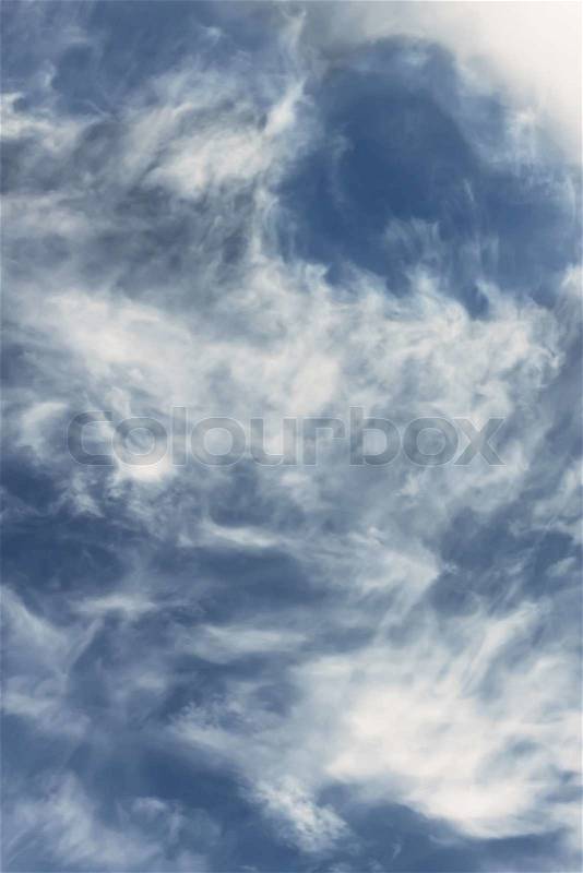 Light white clouds against blue sky, warm summer day, stock photo