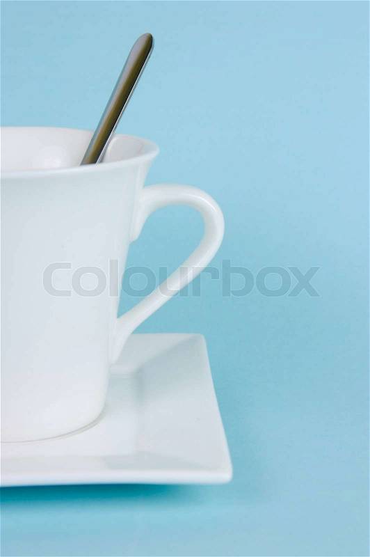 A cup of coffee isolate against a blue background, stock photo