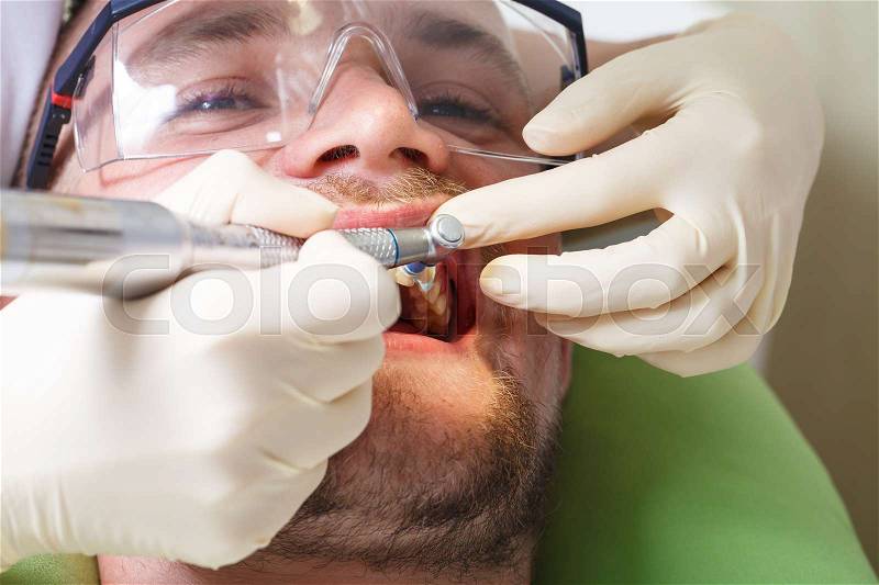 A dentistry, patient examination and treatment at the dentist, stock photo