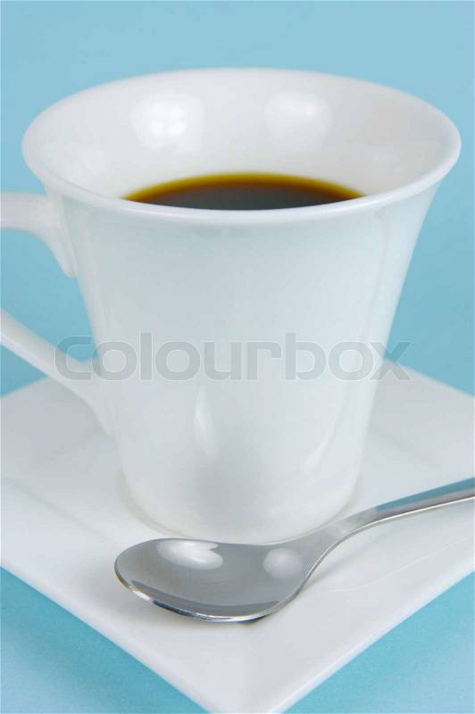 A cup of coffee isolate against a blue background, stock photo
