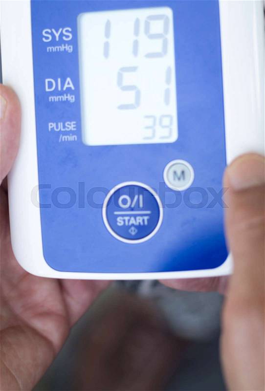 Cardiac blood pressure and irregular heart beat pulse rate meter to show resting heart rate in monitored patient, stock photo