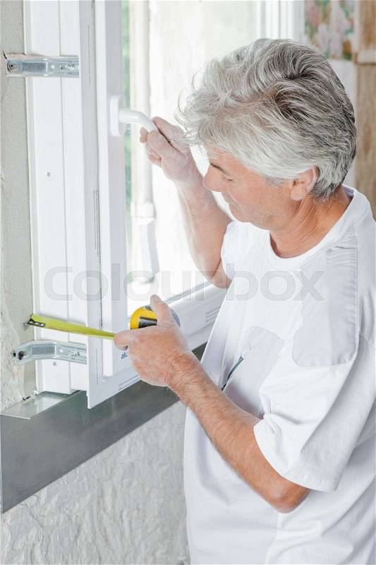 Measuring a window, stock photo