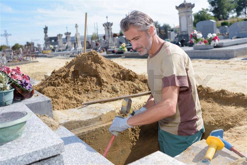 Digging a grave, stock photo