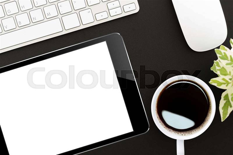 Tablet digital on work desk top view, stock photo