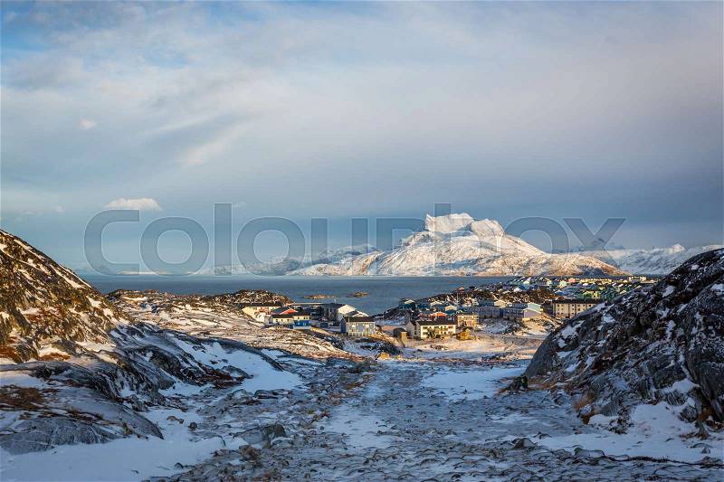 Daylight view to the distant suburb of Nuuk, Sermitsiaq mountain in the background, stock photo