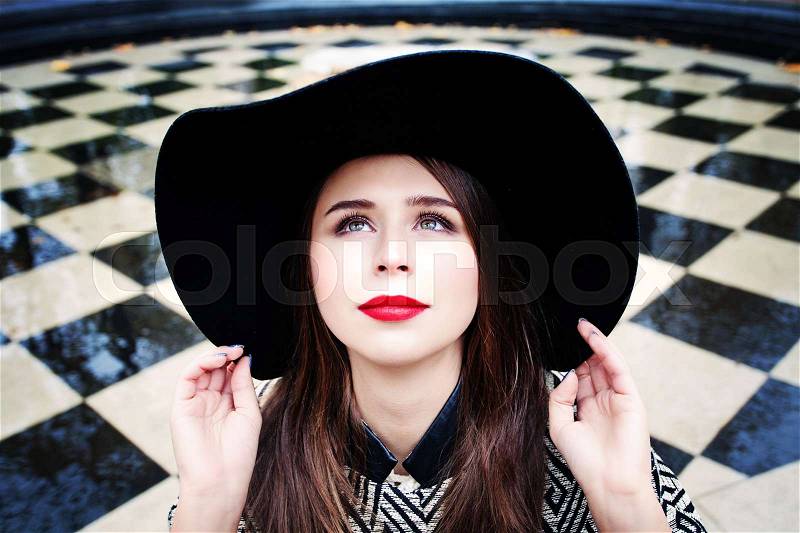 Happy Model Woman in a Hat Looking Up Outdoors, stock photo