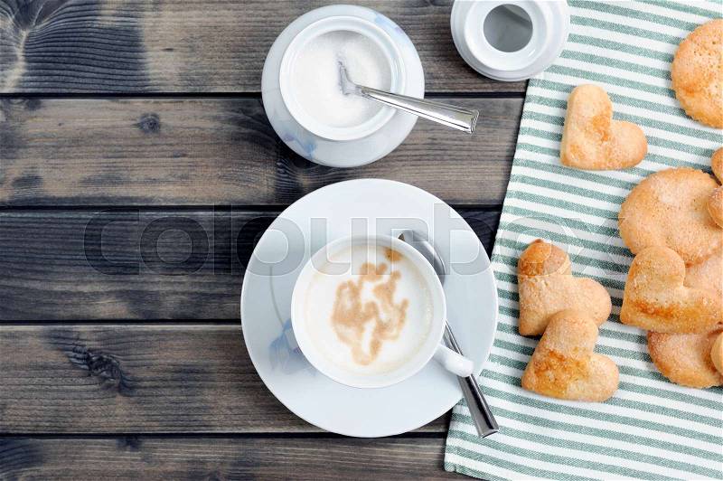 Foods of the Italian breakfast with coffee milk and biscuits on an old wooden table, photographed from above, stock photo